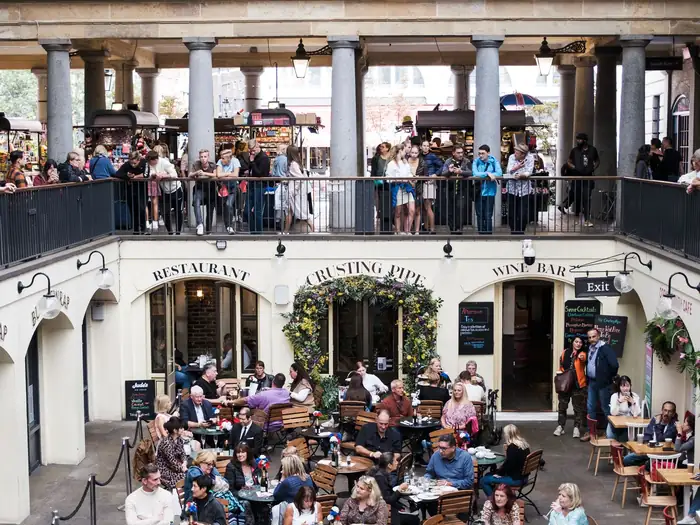 Diners under the arcades of Covent Garden piazza
