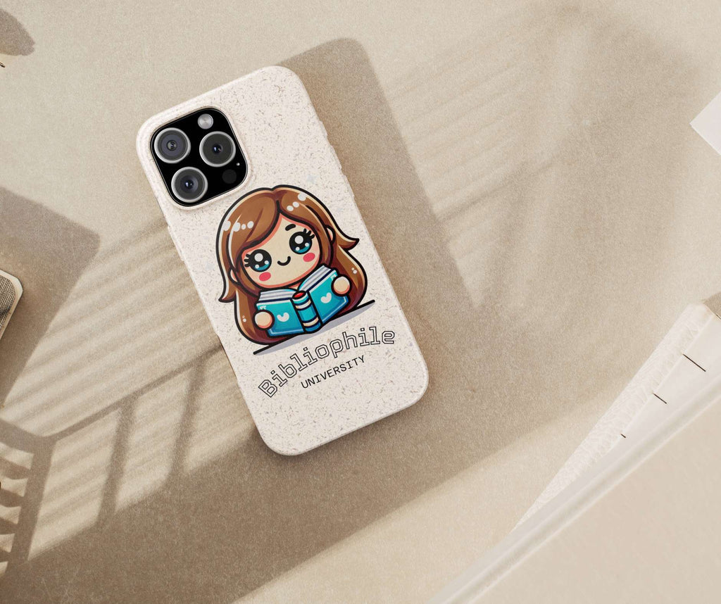 Phone case with a cute illustration of a girl reading a book and the text 'Bibliophile University' on a beige surface.
